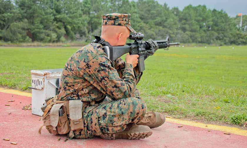 Marine recruit in seated shooting position